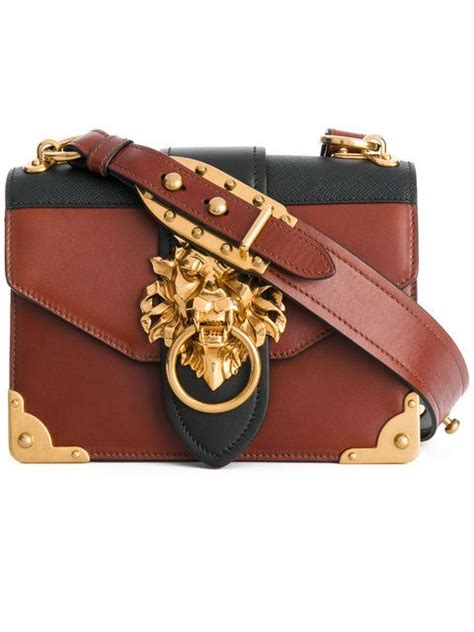 lion embellished shoulder bag.